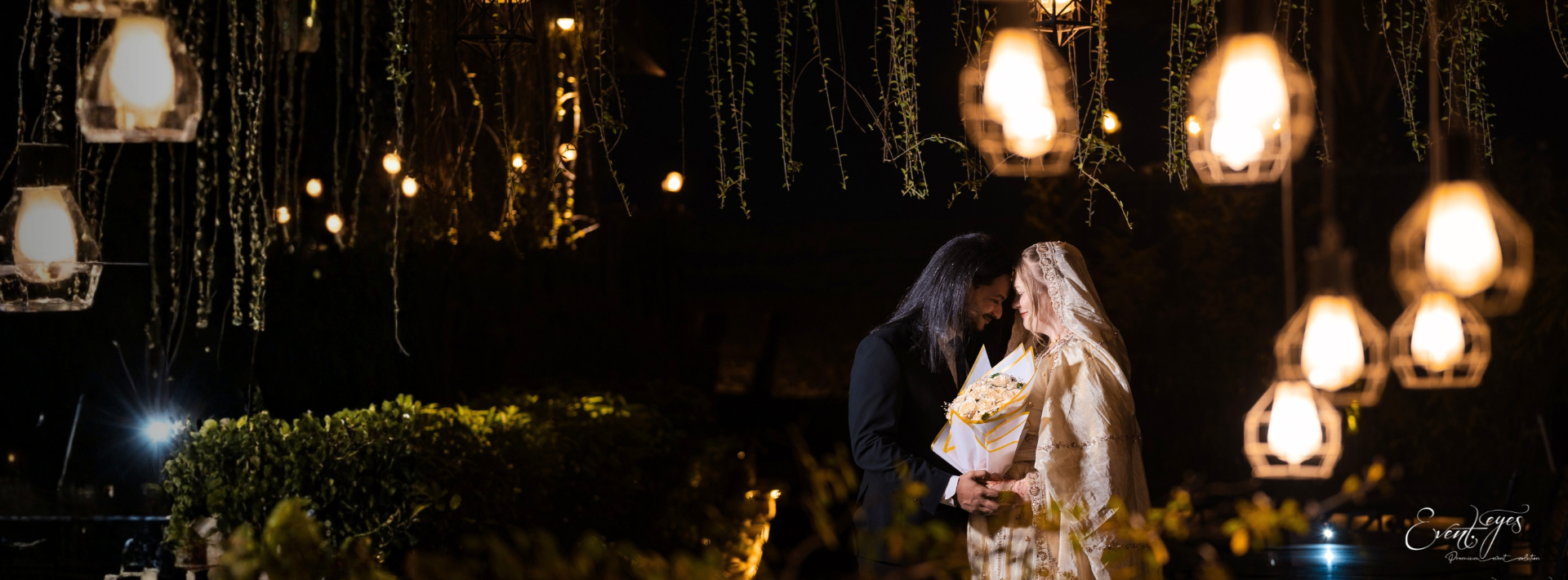 Couple under hanging lanterns